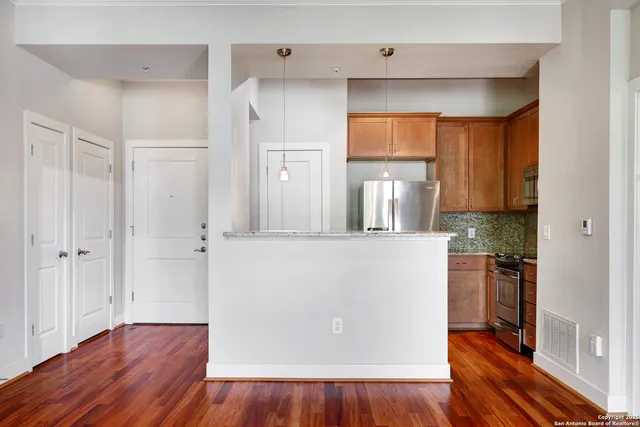 a view of a kitchen from the hallway