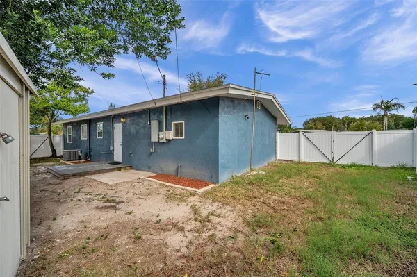 an aerial view of a house with a lake view