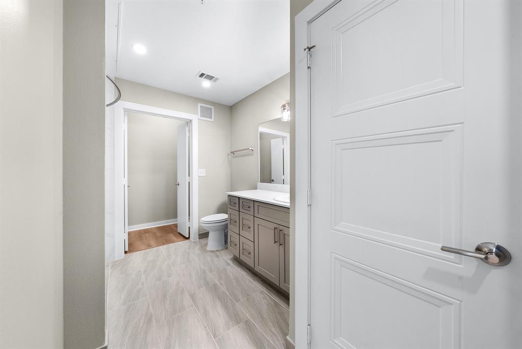 3522 Main Street, Unit 203 Rowlett, TX 75088 - Photo 13 of 20 a bathroom with a sink and mirror