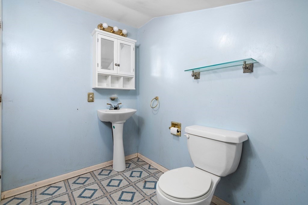 5 Maynard Way Buzzards Bay, MA 02532 - Photo 11 of 28 a bathroom with a sink toilet and a mirror