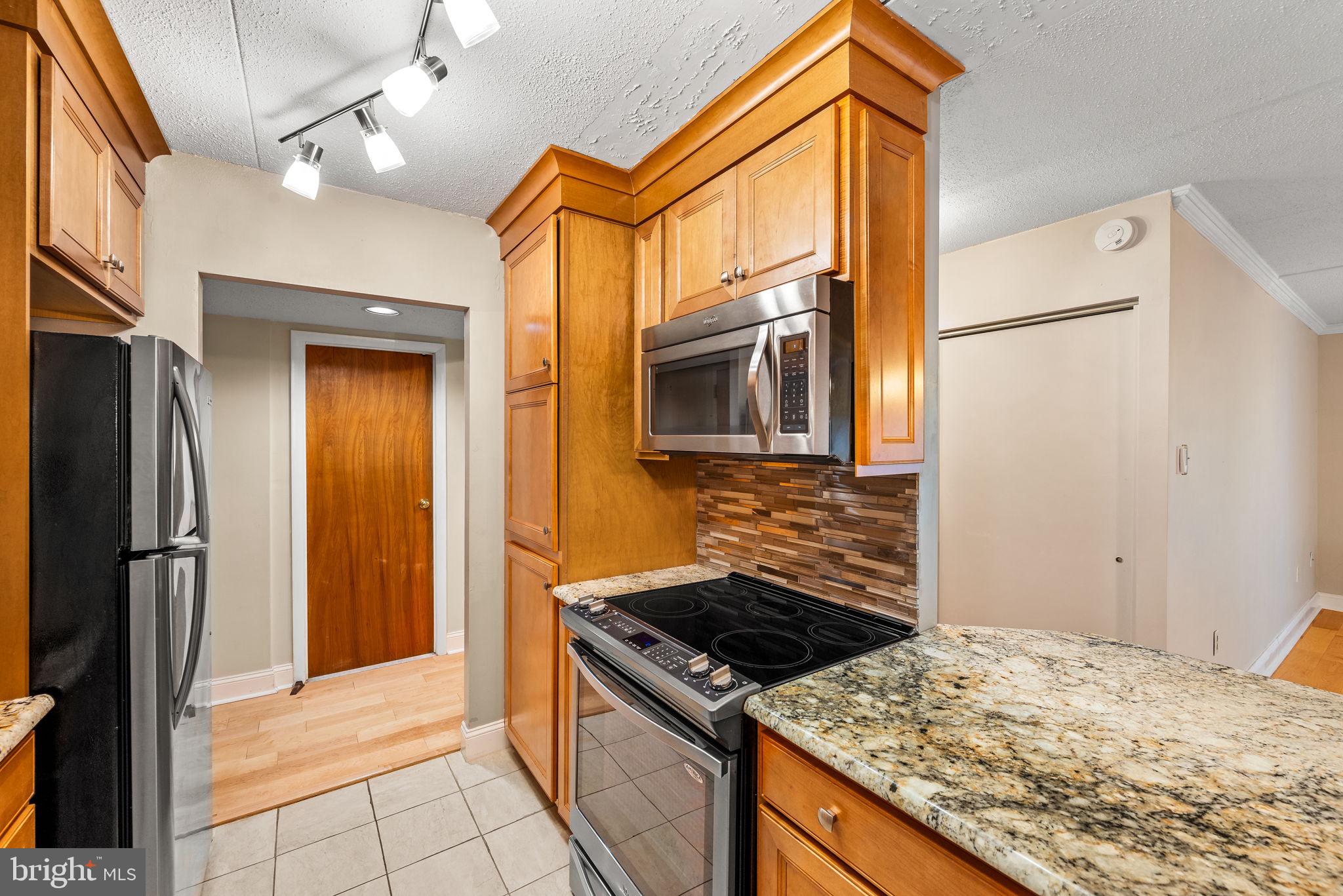 700 Avondale Road, Unit 3D Wallingford, PA 19086 - Photo 8 of 24 Natural stone countertops and SS appliances