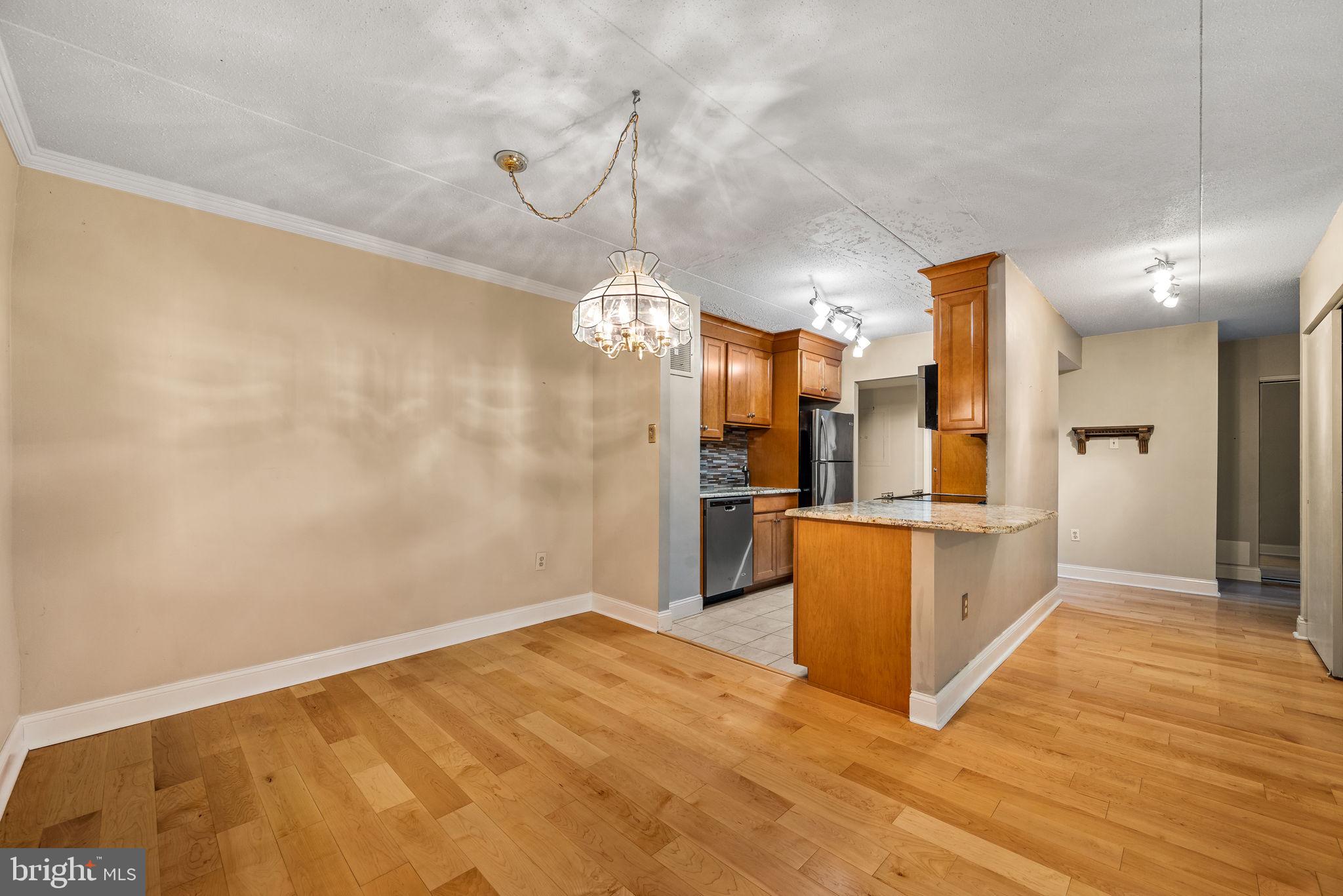 700 Avondale Road, Unit 3D Wallingford, PA 19086 - Photo 9 of 24 Kitchen counter with a breakfast bar for two.