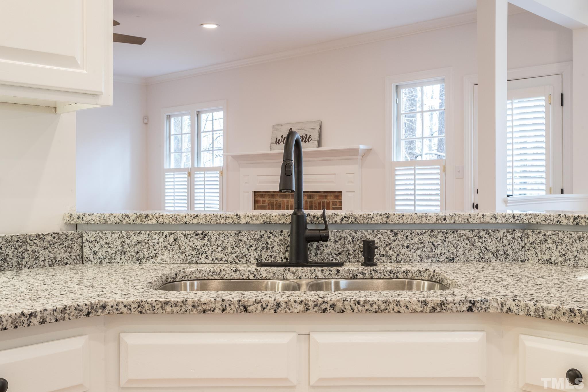 2308 Hideaway Court Raleigh, NC 27613 - Photo 11 of 43 a view of a kitchen counter top a sink and dishwasher