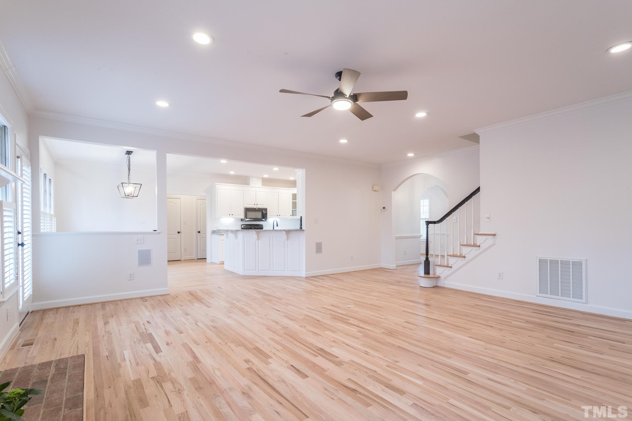 2308 Hideaway Court Raleigh, NC 27613 - Photo 17 of 43 a view of empty room with wooden floor and fan