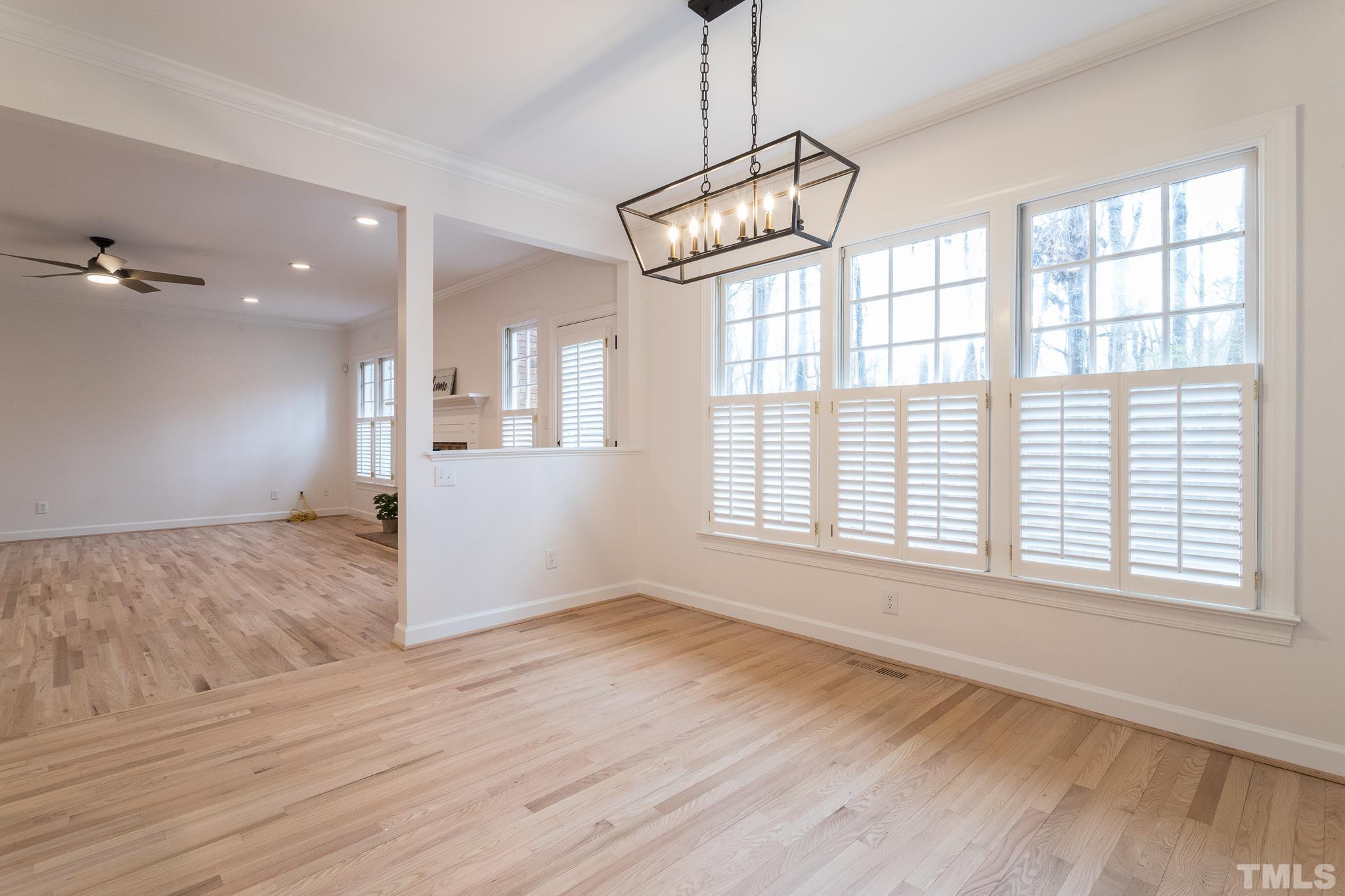 2308 Hideaway Court Raleigh, NC 27613 - Photo 19 of 43 a view of an empty room with wooden floor and a window