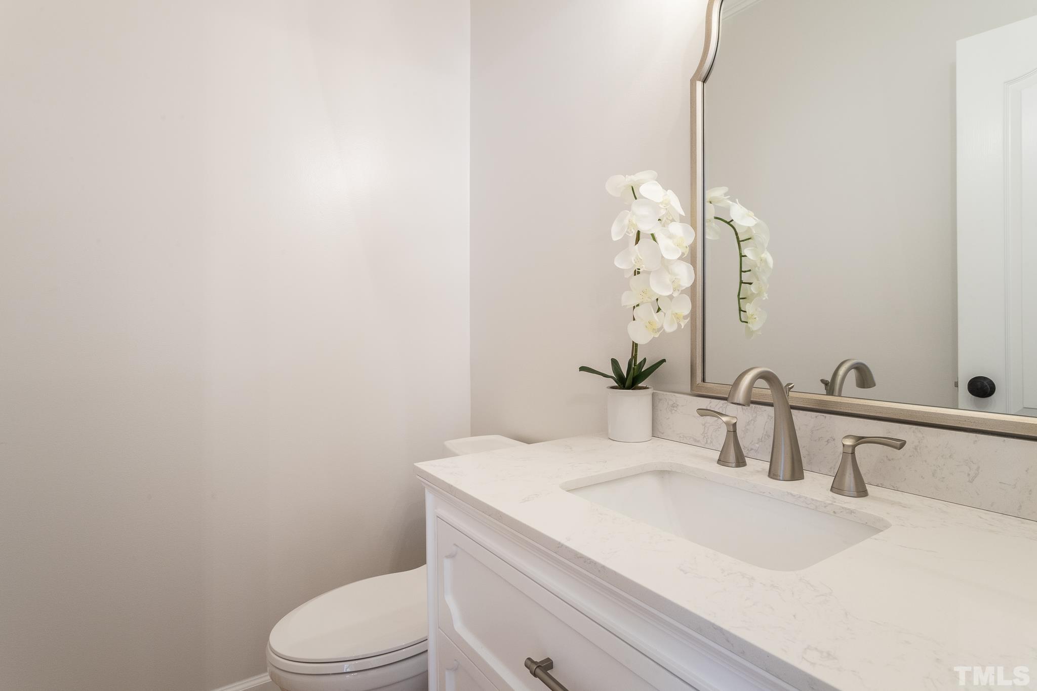 2308 Hideaway Court Raleigh, NC 27613 - Photo 21 of 43 a bathroom with a sink a toilet and shower