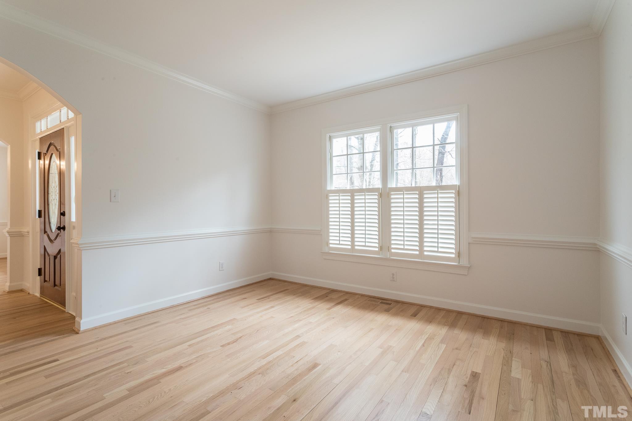 2308 Hideaway Court Raleigh, NC 27613 - Photo 23 of 43 an empty room with wooden floor and windows