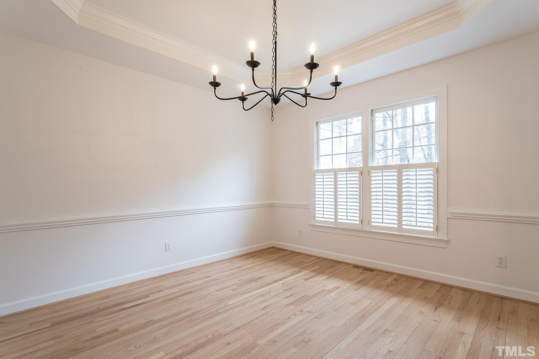 2308 Hideaway Court Raleigh, NC 27613 - Photo 25 of 43 wooden floor in an empty room with a window