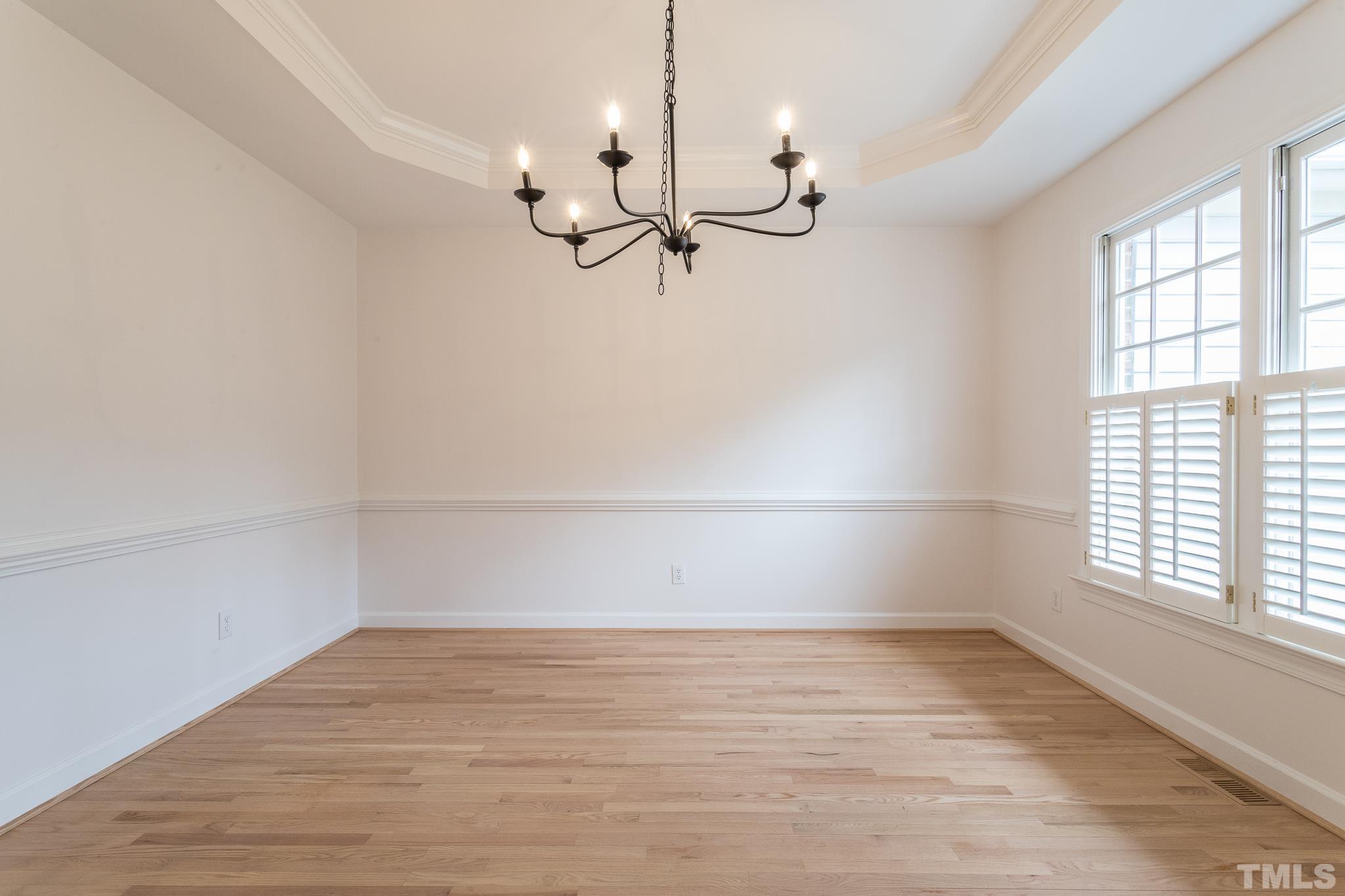 2308 Hideaway Court Raleigh, NC 27613 - Photo 26 of 43 wooden floor in an empty room with a window