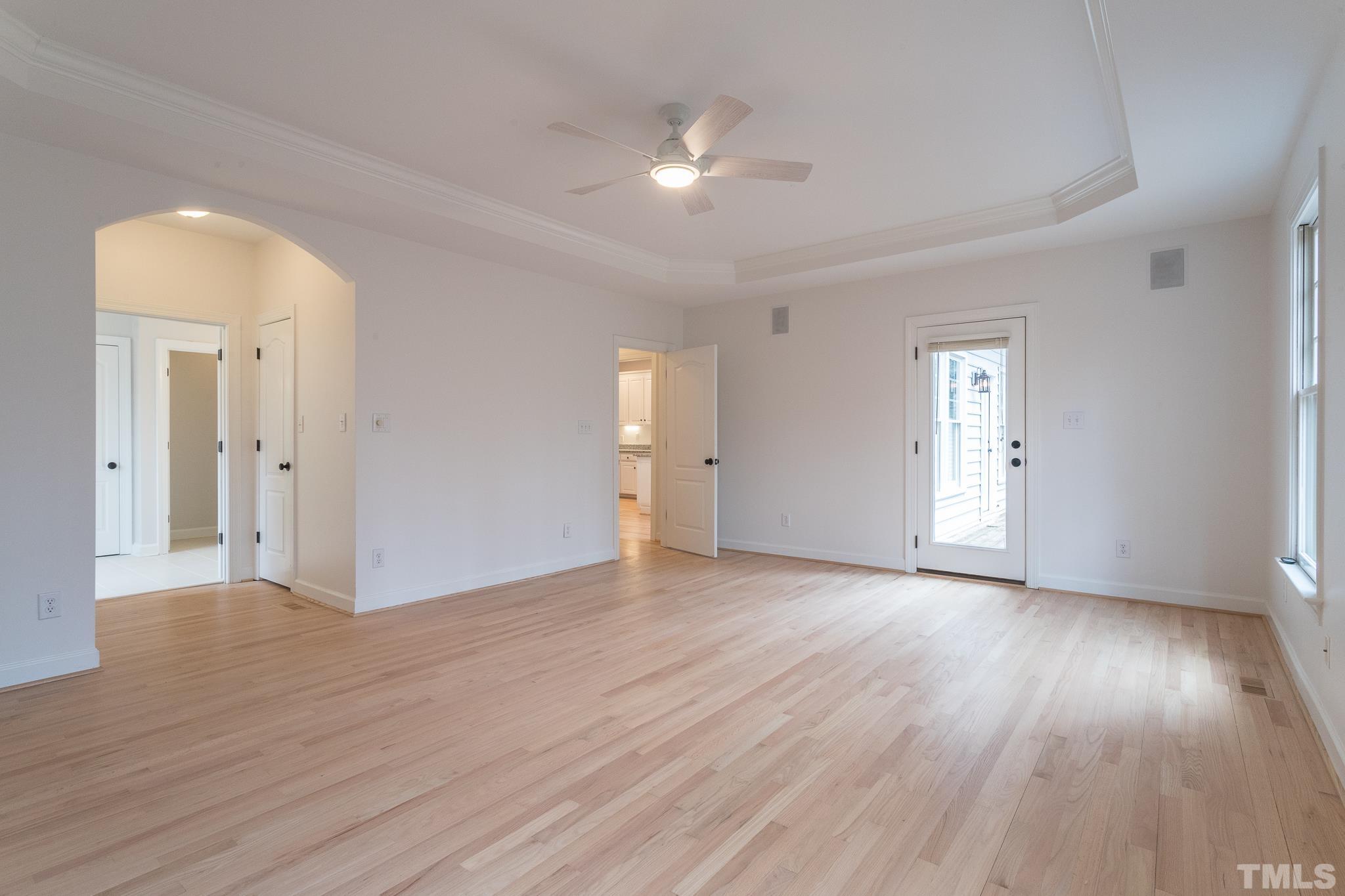 2308 Hideaway Court Raleigh, NC 27613 - Photo 28 of 43 a view of an empty room with wooden floor and a window
