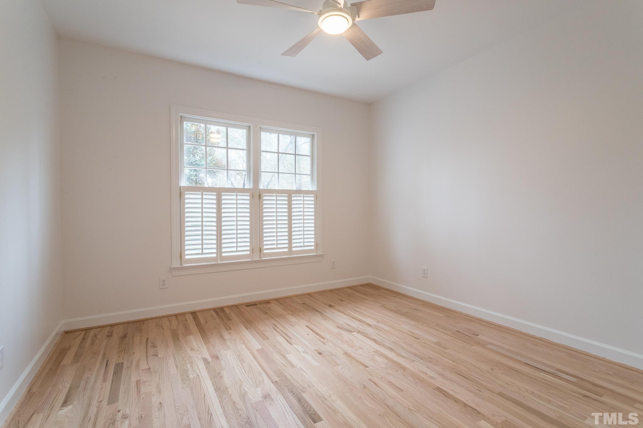 2308 Hideaway Court Raleigh, NC 27613 - Photo 29 of 43 an empty room with wooden floor and windows