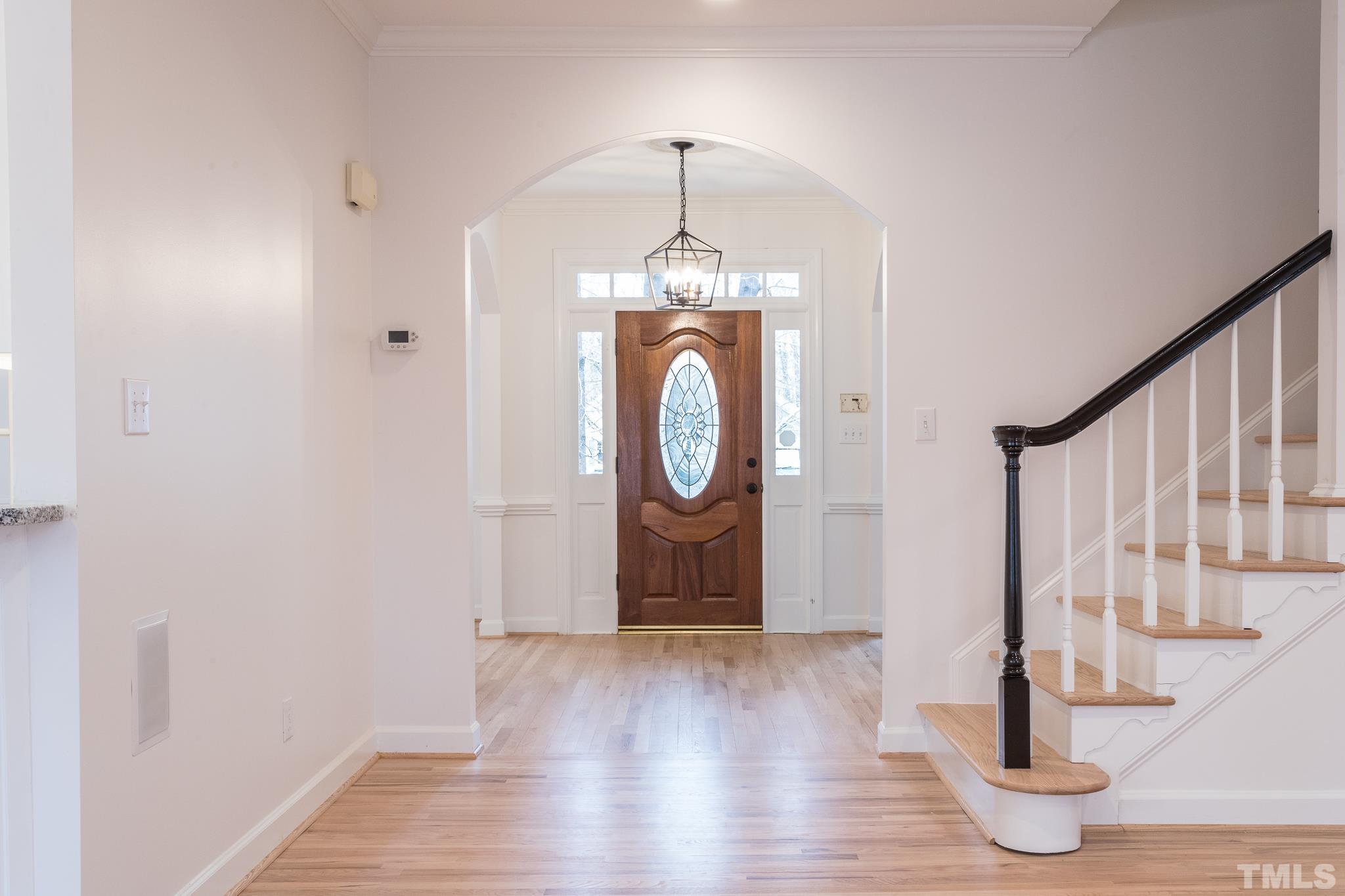 2308 Hideaway Court Raleigh, NC 27613 - Photo 3 of 43 a view of an entryway with wooden floor and door