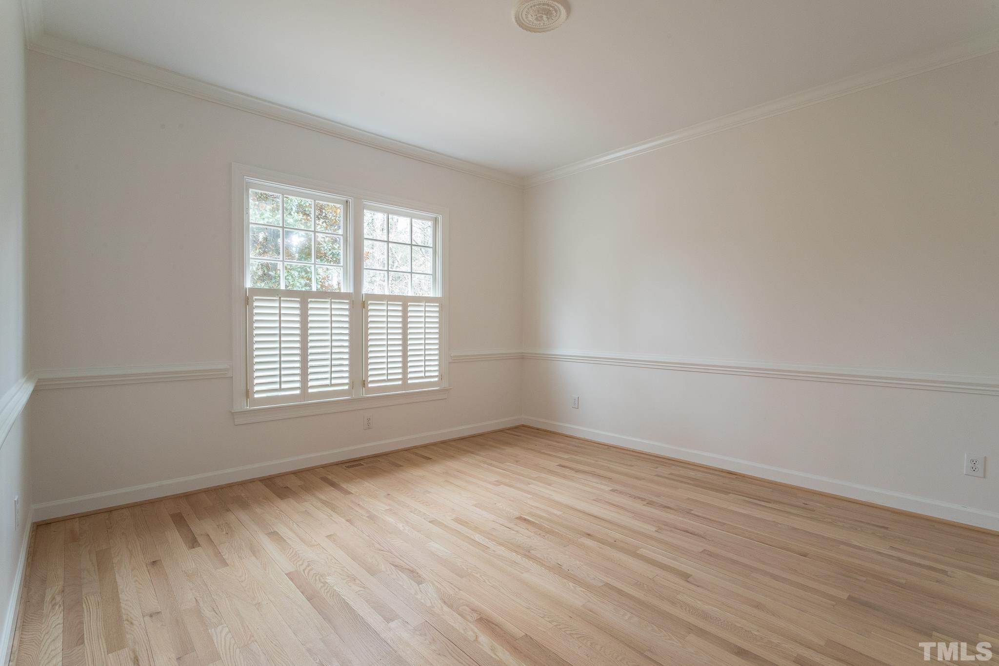 2308 Hideaway Court Raleigh, NC 27613 - Photo 31 of 43 an empty room with wooden floor and windows