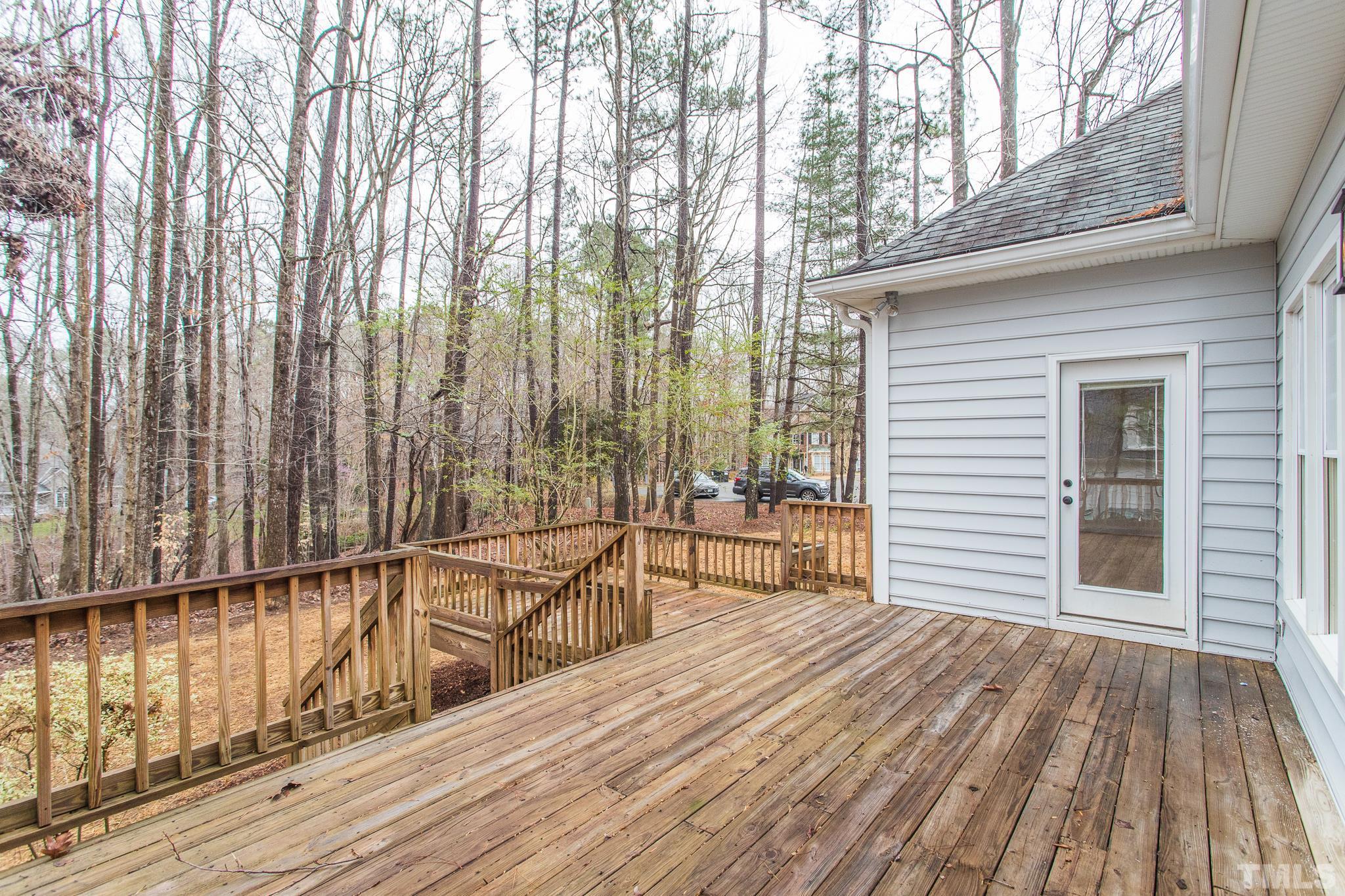 2308 Hideaway Court Raleigh, NC 27613 - Photo 42 of 43 a view of balcony with floor to ceiling windows and wooden floor