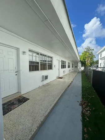 a view of a house with backyard and garden