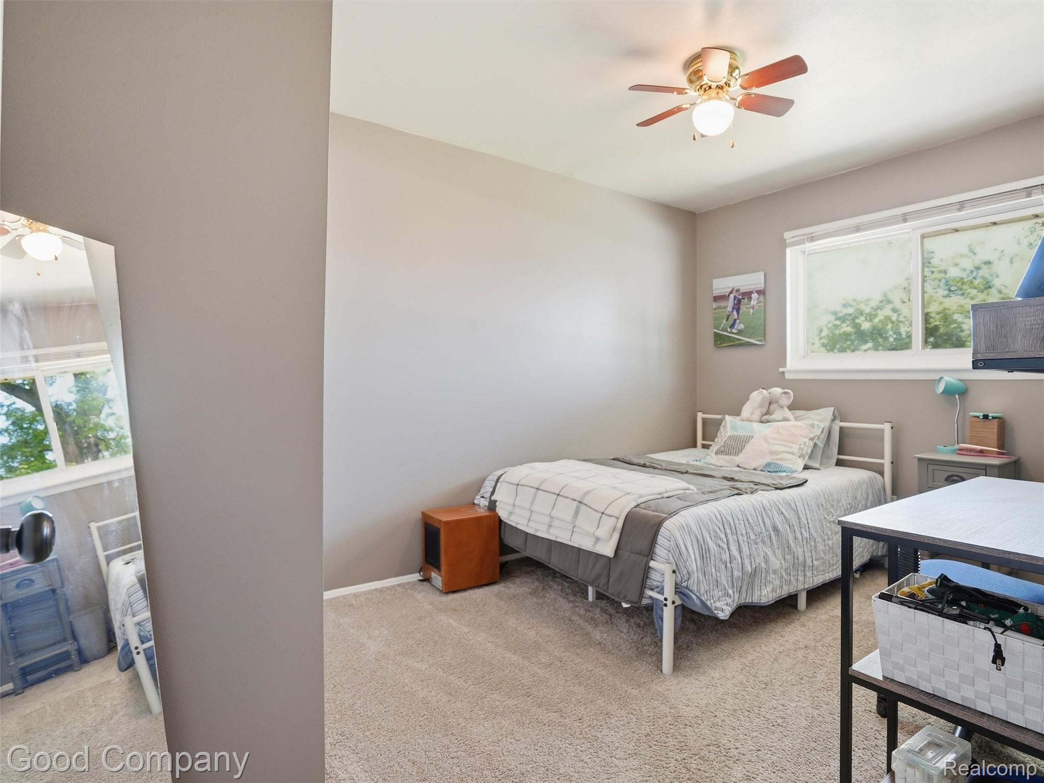 30632 Hayes Road Roseville, MI 48066 - Photo 21 of 32 Bedroom featuring neutral wall paint, textured carpeting, a multi-pane window with blinds, and a ceiling fan with integrated lighting