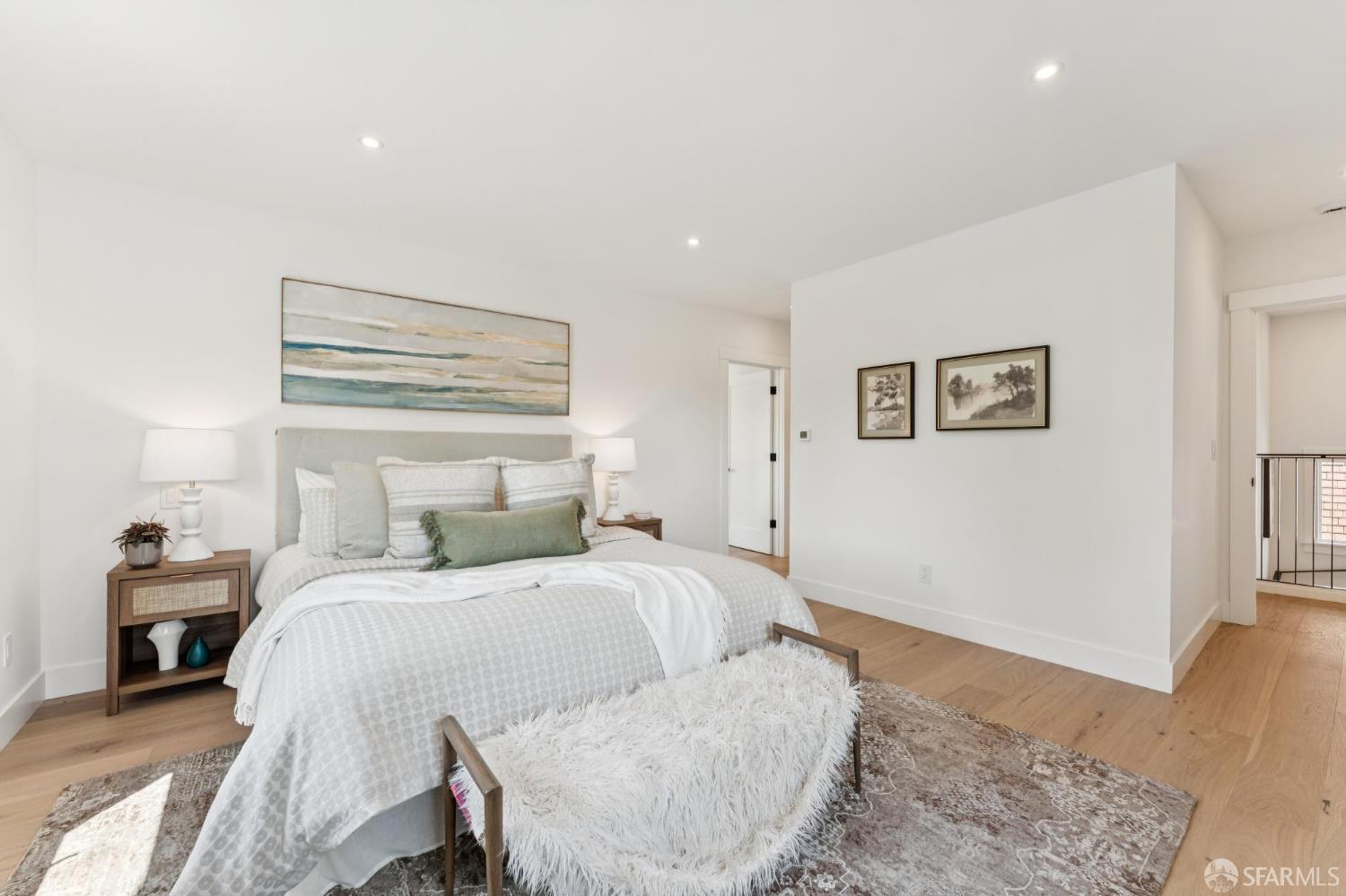 2815 Ashby Avenue Berkeley, CA 94705 - Photo 11 of 17 a bedroom with a bed and a lamp with wooden floor