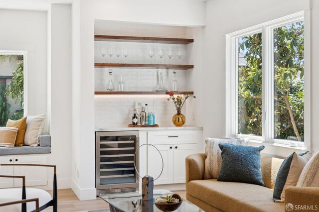 a room with a window and flowerpot