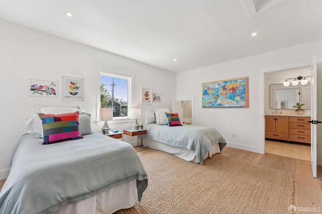 a bedroom with bed and a couch