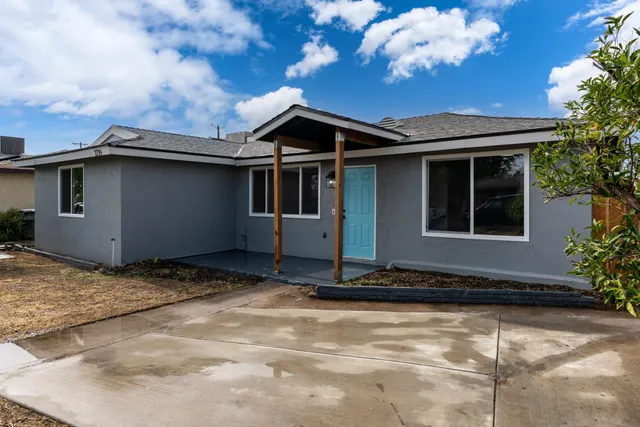 a house with trees in the background