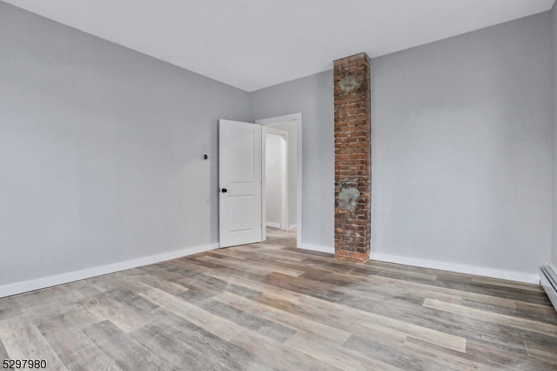 25 Kiel Avenue, Unit 1 Butler, NJ 07405 - Photo 15 of 23 a view of an empty room with a window