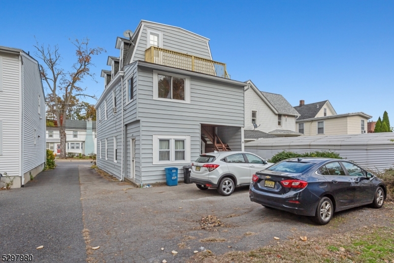 25 Kiel Avenue, Unit 1 Butler, NJ 07405 - Photo 23 of 23 a car parked in front of a house