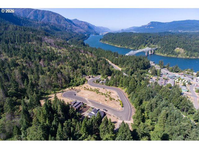 935 Spelling Place, Unit 17 Cascade Locks, OR 97014 - Photo 3 of 3 a view of a lush green hillside and a houses