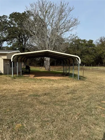 a view of house with yard