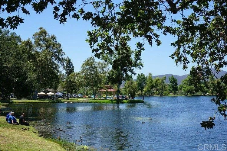 0 Mariposa Street Santee, CA 92071 - Photo 10 of 11 a view of a lake with a house in the background