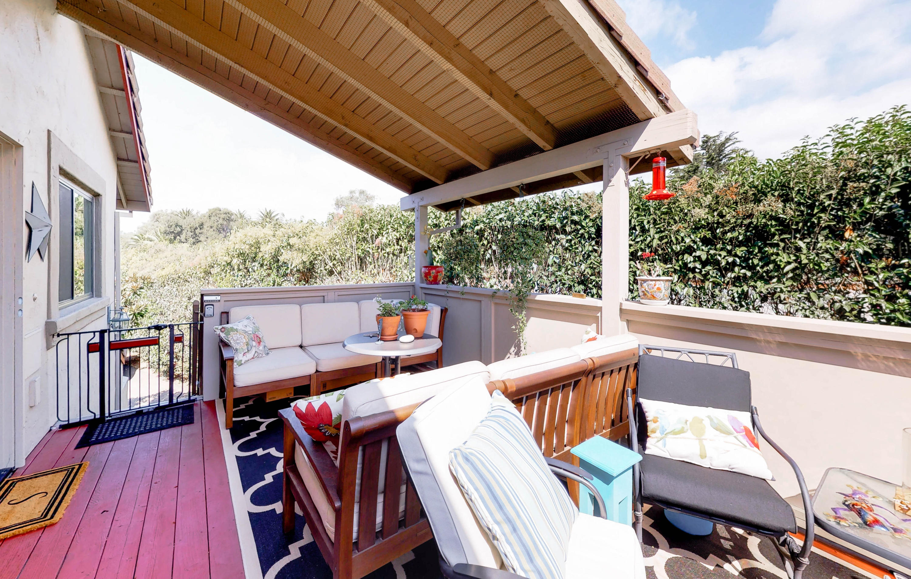 a view of a two chairs in the balcony