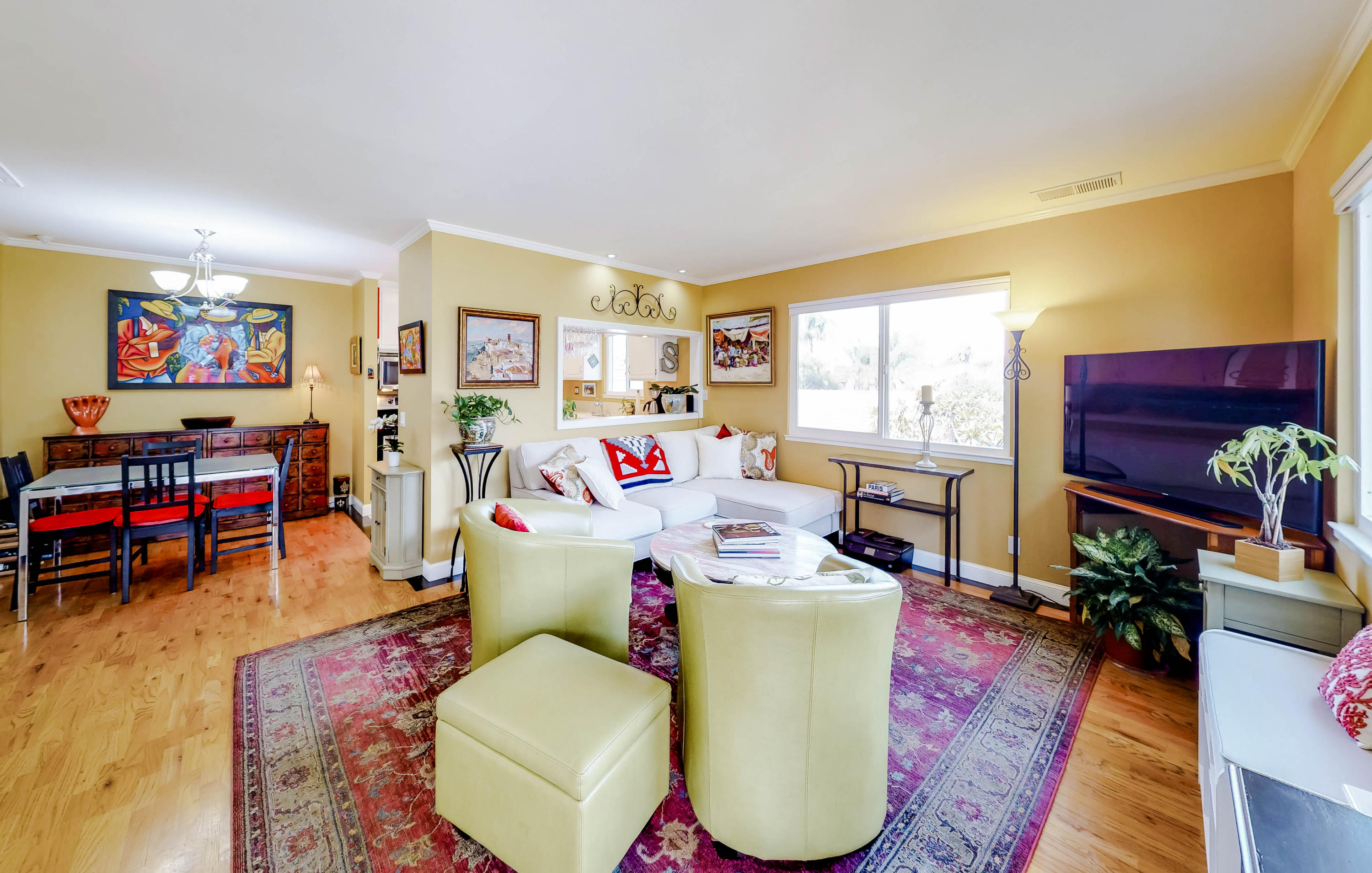4344 Modoc Road, Unit 16 Santa Barbara, CA 93110 - Photo 2 of 11 a living room with furniture and a flat screen tv