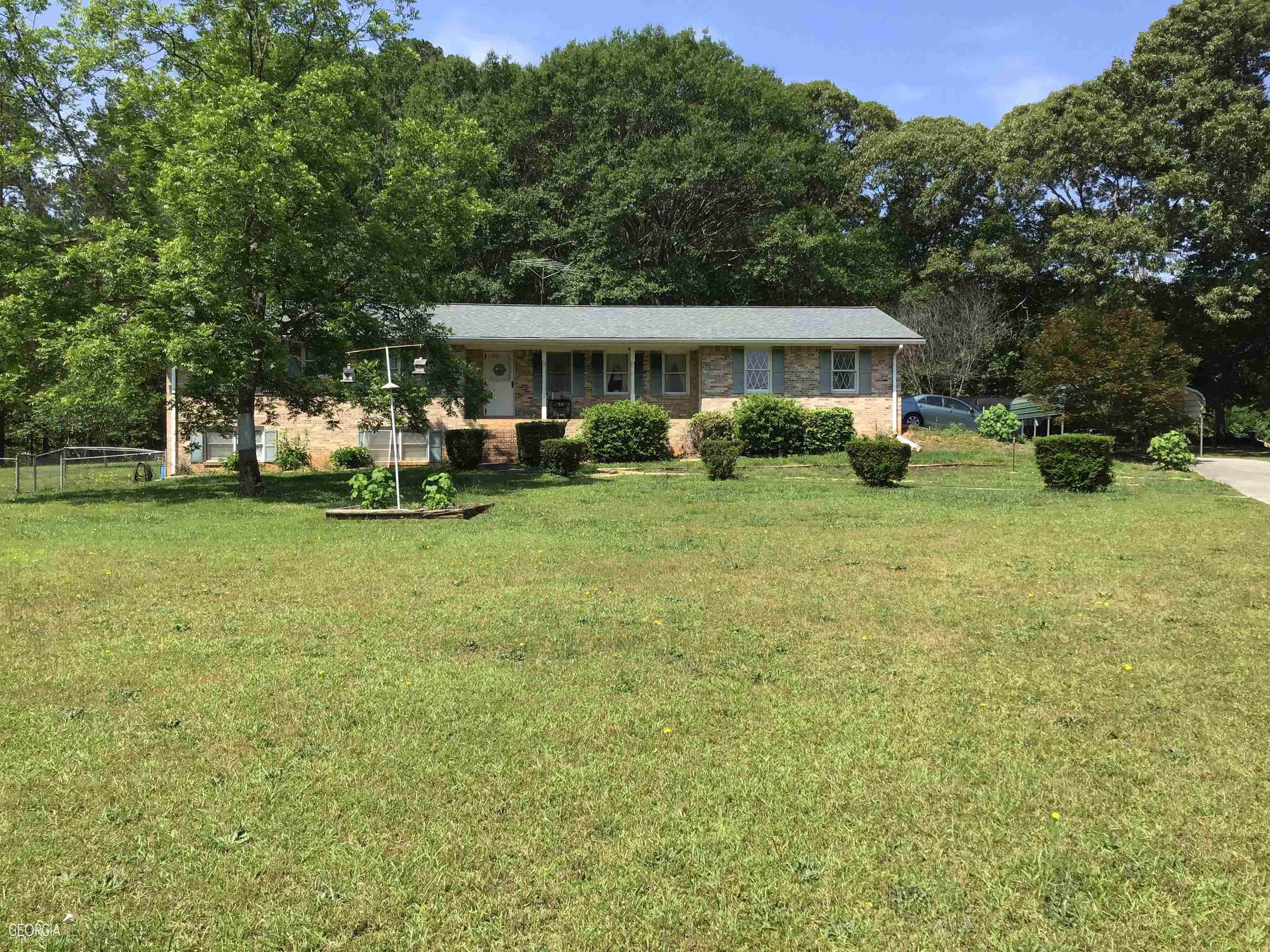 2537 East Atlanta Road Rex, GA 30273 - Photo 1 of 1 a view of a house with backyard and sitting area