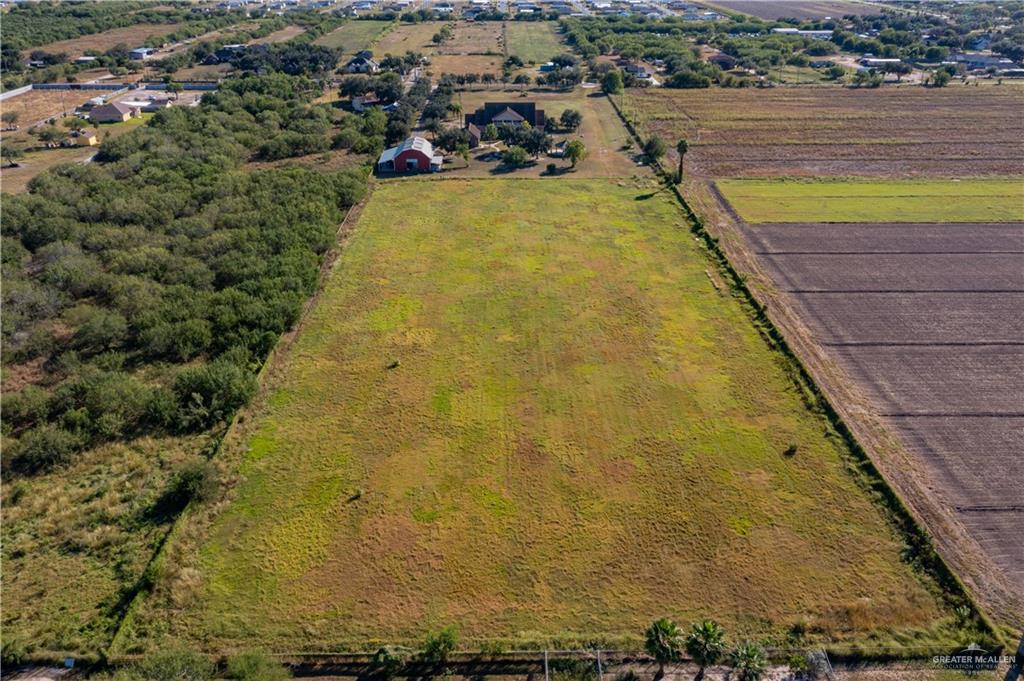 234 East Earling Road Alamo, TX 78516 - Photo 13 of 13 a view of a swimming pool with outdoor seating and lake view