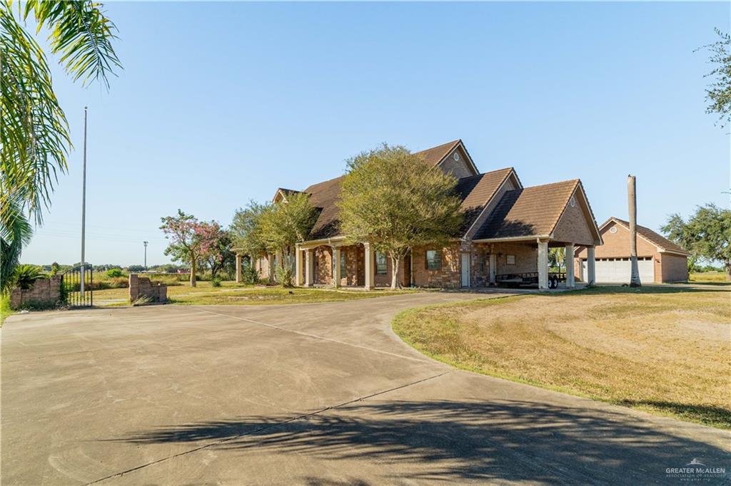 234 East Earling Road Alamo, TX 78516 - Photo 9 of 13 a front view of residential houses with yard and road