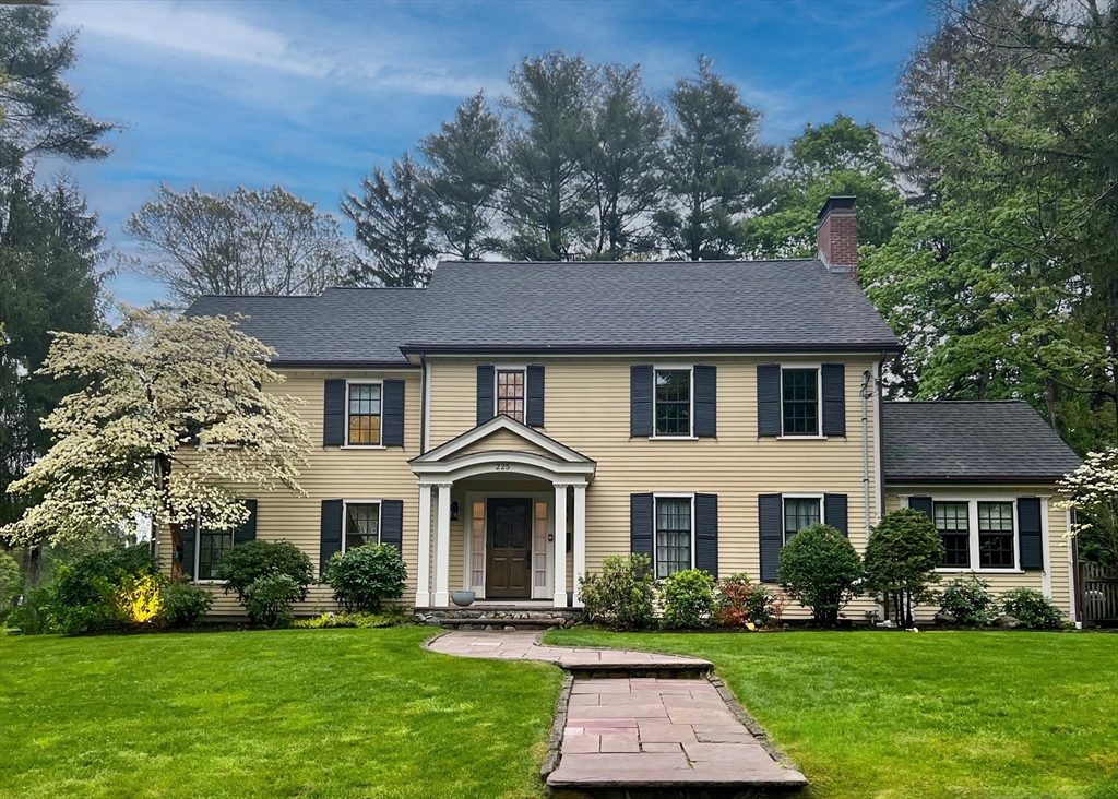 225 Arnold Road Newton, MA 02459 - Photo 1 of 20 a front view of a house with a yard
