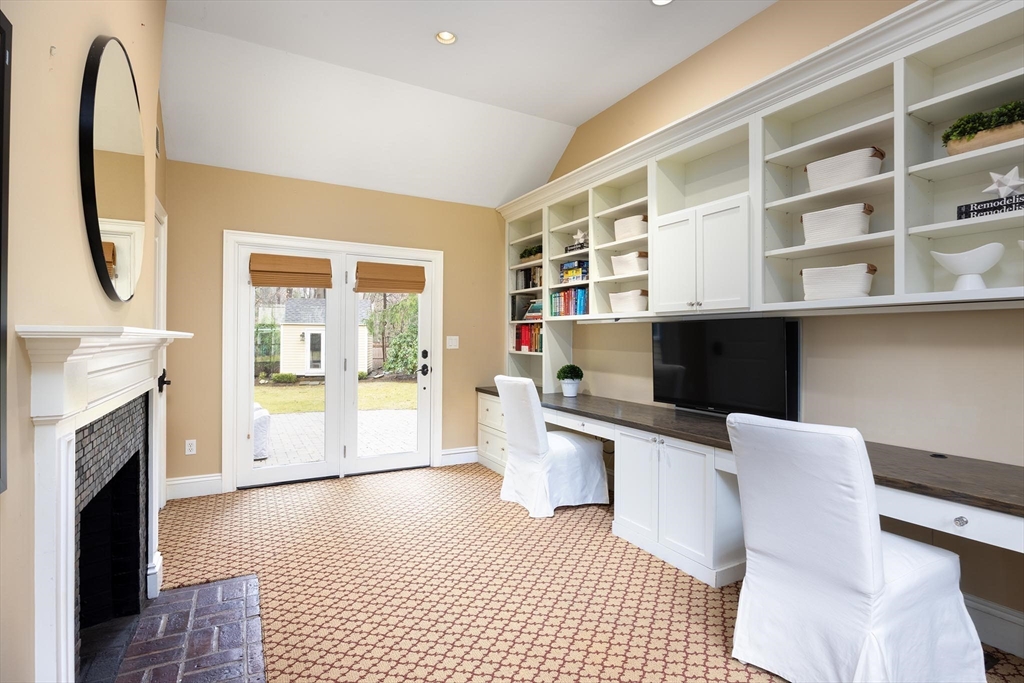 225 Arnold Road Newton, MA 02459 - Photo 13 of 20 a kitchen with stainless steel appliances granite countertop a stove and a refrigerator