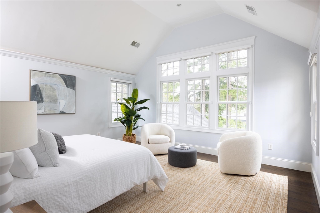 225 Arnold Road Newton, MA 02459 - Photo 14 of 20 a bedroom with a bed and wooden floor