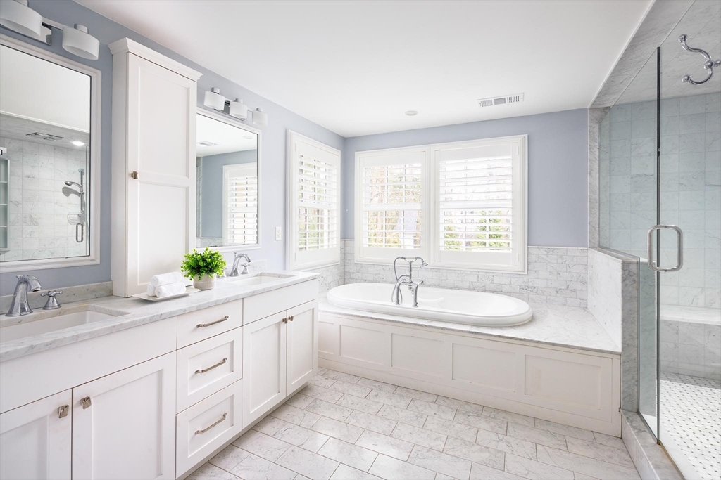 225 Arnold Road Newton, MA 02459 - Photo 15 of 20 a spacious bathroom with a double vanity sink mirror and a bathtub