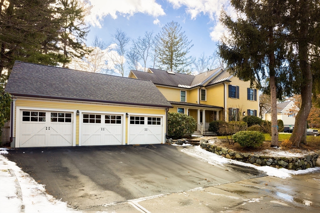 225 Arnold Road Newton, MA 02459 - Photo 16 of 20 a view of a white house with a large tree
