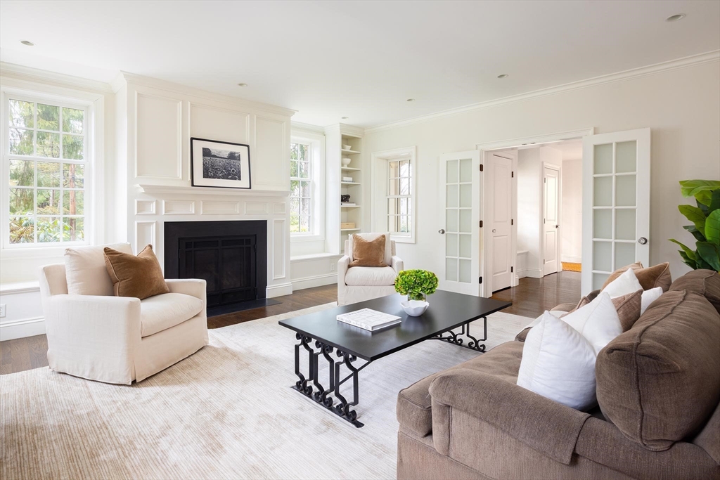 225 Arnold Road Newton, MA 02459 - Photo 4 of 20 a living room with furniture and a fireplace