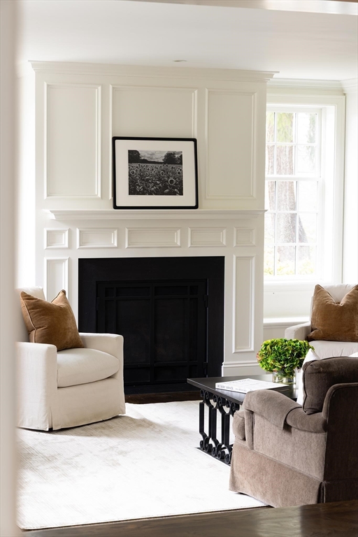 225 Arnold Road Newton, MA 02459 - Photo 5 of 20 a living room with furniture and a fireplace