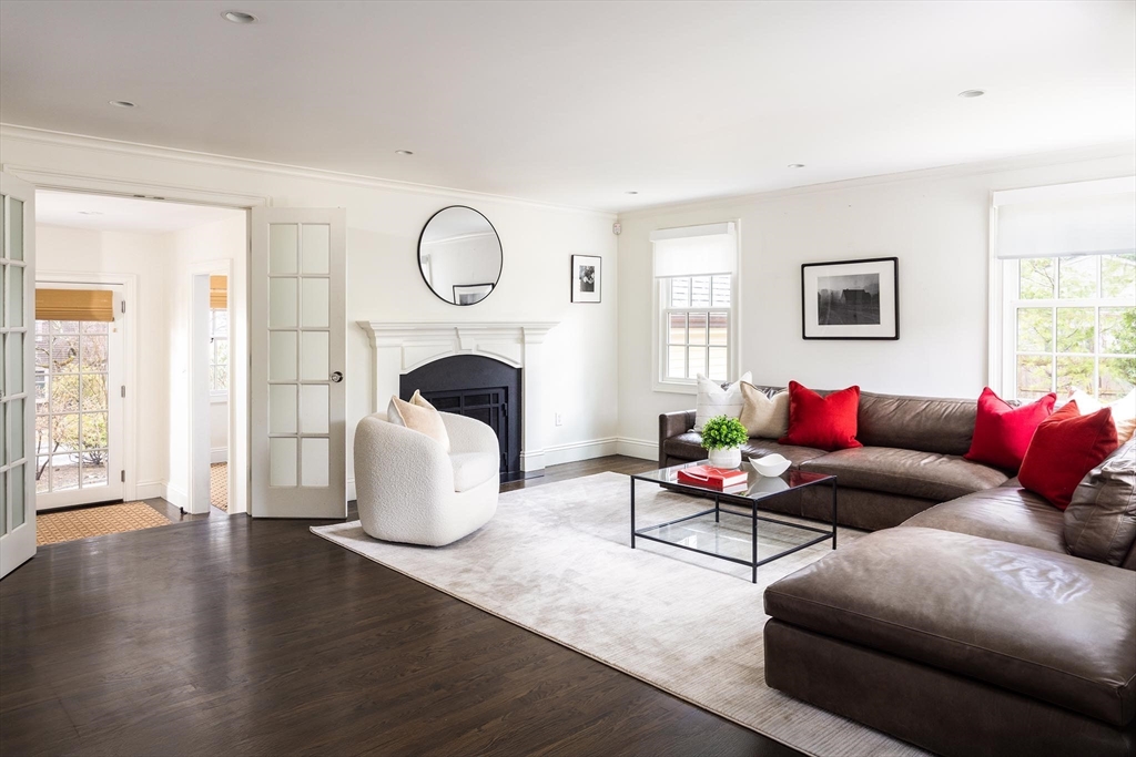 225 Arnold Road Newton, MA 02459 - Photo 10 of 20 a living room with furniture wooden floor and a fireplace