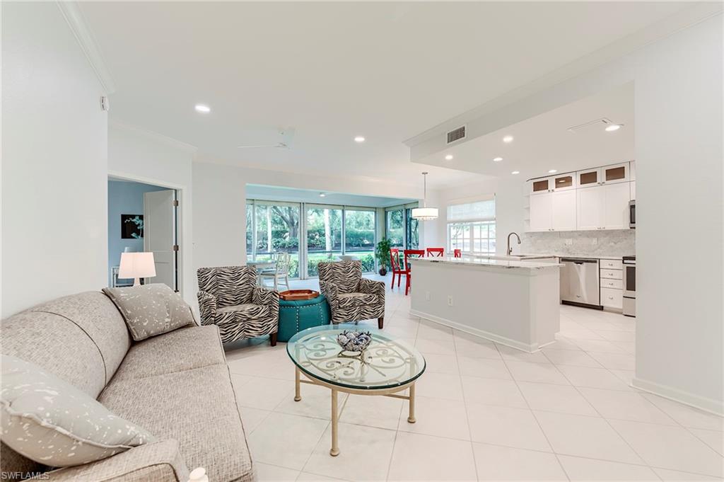 23136 Rosedale Drive, Unit 102 Estero, FL 34135 - Photo 16 of 32 a living room with stainless steel appliances furniture and a kitchen view