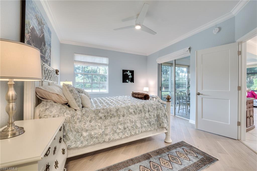 23136 Rosedale Drive, Unit 102 Estero, FL 34135 - Photo 19 of 32 a bedroom with a large bed and a window
