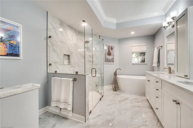 a bathroom with a granite countertop sink mirror and toilet