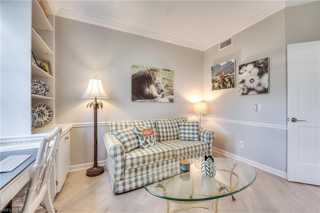 23136 Rosedale Drive, Unit 102 Estero, FL 34135 - Photo 27 of 32 a living room with furniture