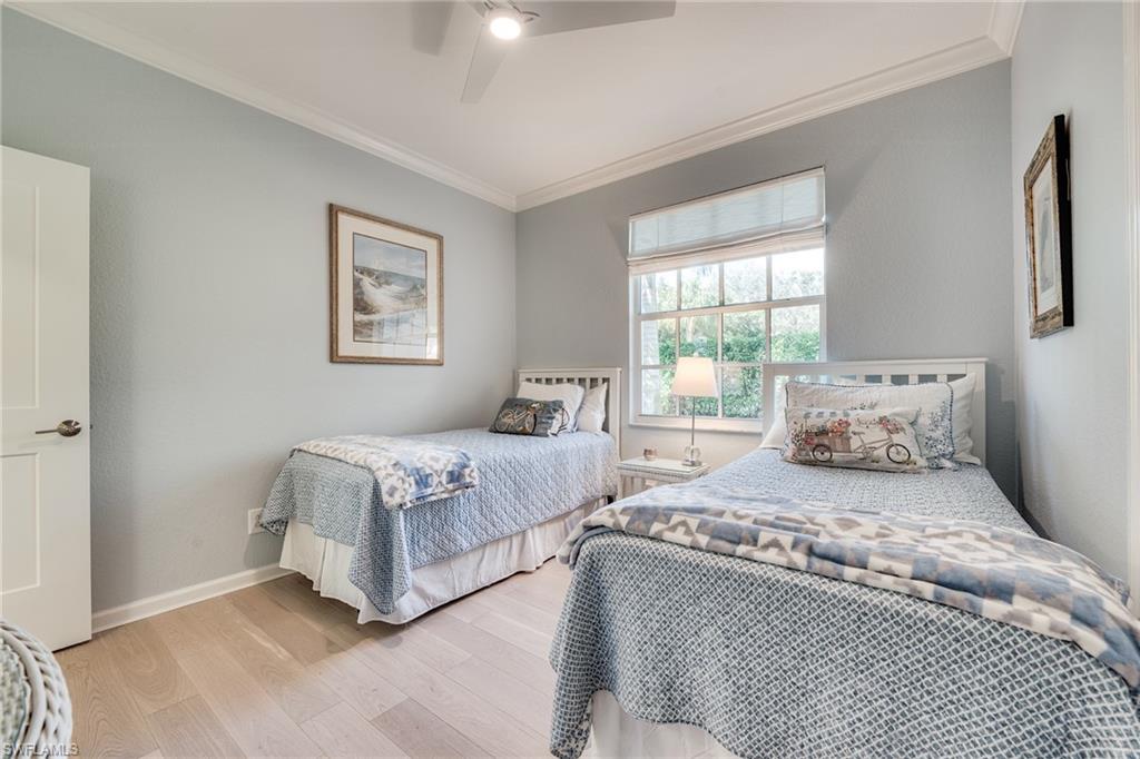 23136 Rosedale Drive, Unit 102 Estero, FL 34135 - Photo 30 of 32 a bedroom with double bed and a window