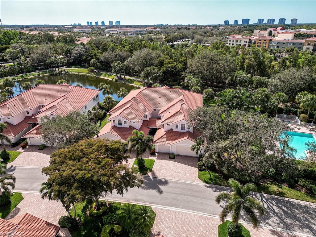 23136 Rosedale Drive, Unit 102 Estero, FL 34135 - Photo 3 of 32 an aerial view of a houses with a yard