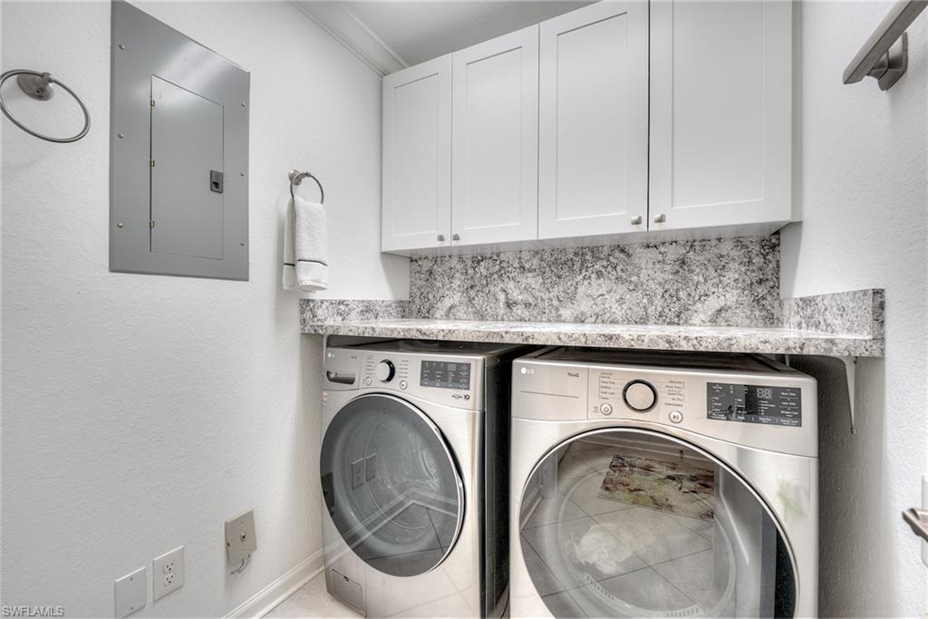 23136 Rosedale Drive, Unit 102 Estero, FL 34135 - Photo 31 of 32 a utility room with dryer and washer