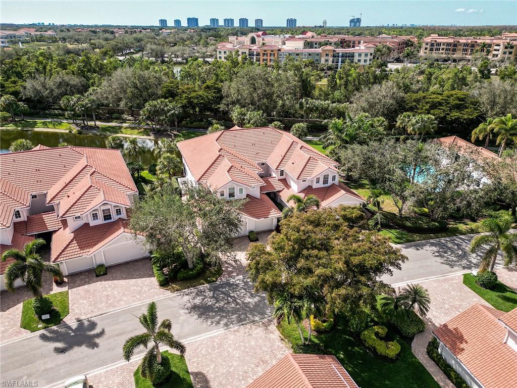 23136 Rosedale Drive, Unit 102 Estero, FL 34135 - Photo 4 of 32 an aerial view of a house with a garden and lake view
